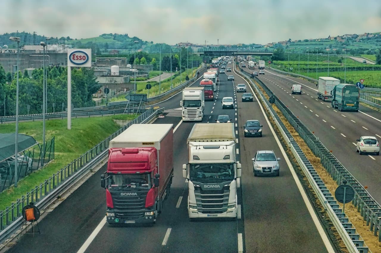 Professional freight trucks on highway transportation logistics